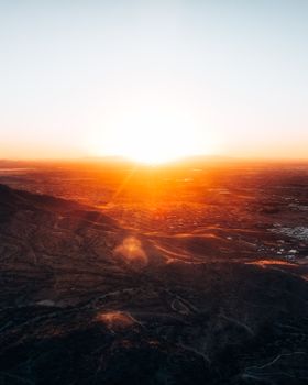 A breathtaking aerial view of the Arizona desert at sunset with vibrant colors.