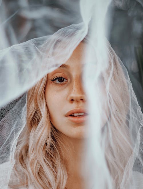 Crop woman with translucent veil