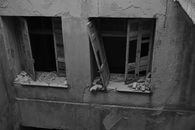 Close-up of Destroyed Windows in an Abandoned Building 