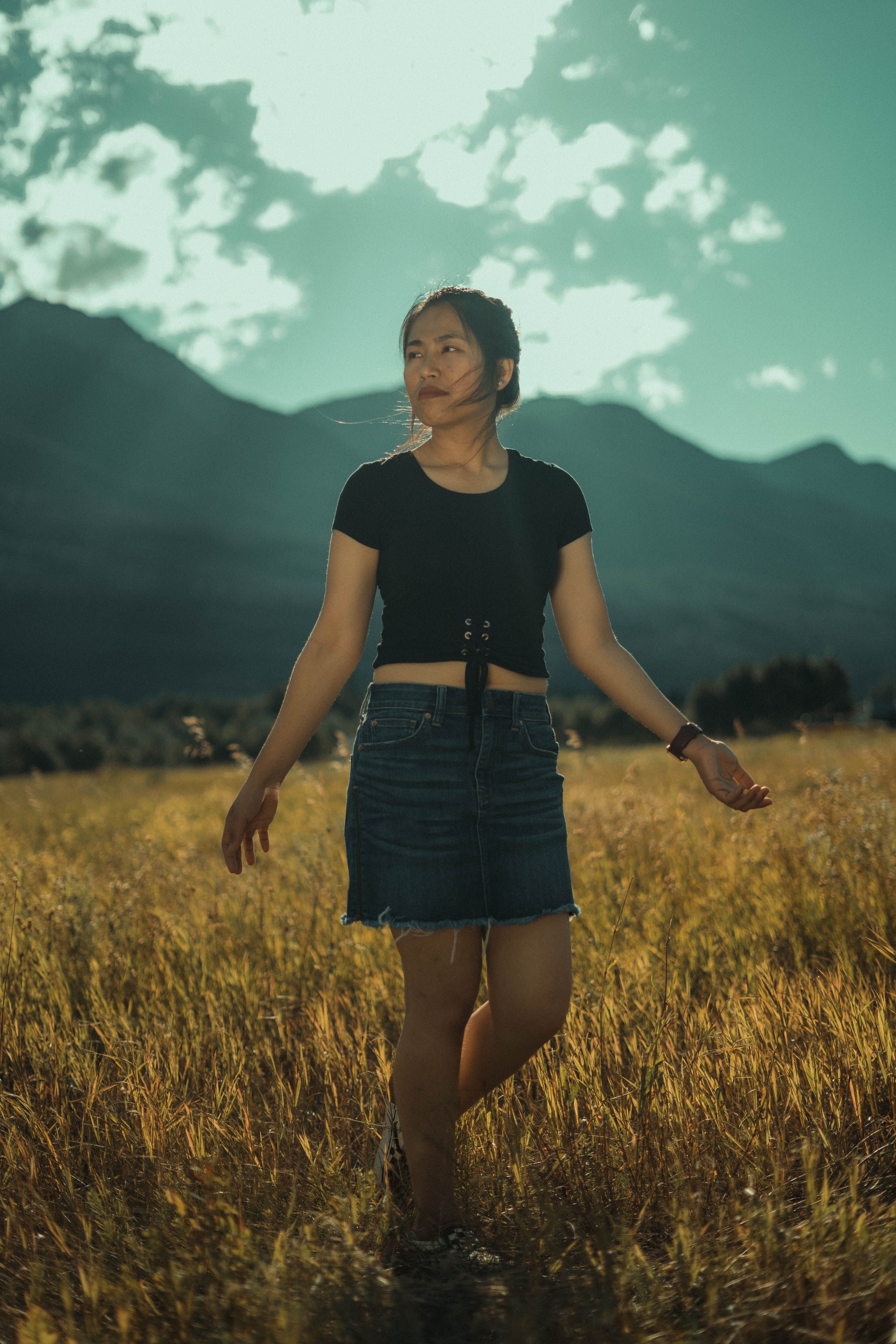 Portrait of a Woman Standing in a Field · Free Stock Photo