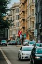 View of a City Street with Cars and a Flag