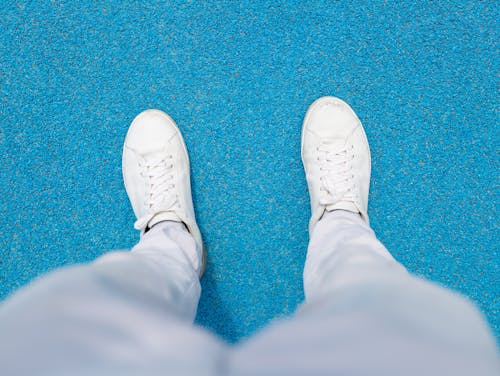 Person Wearing White Sneakers