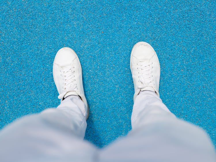 Person Wearing White Sneakers