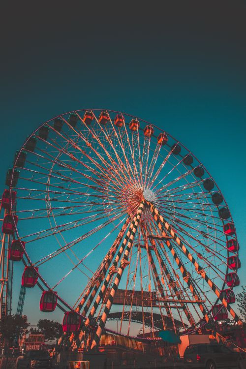 Free A vibrant Ferris wheel towering against a clear evening sky in Ocean City. Stock Photo