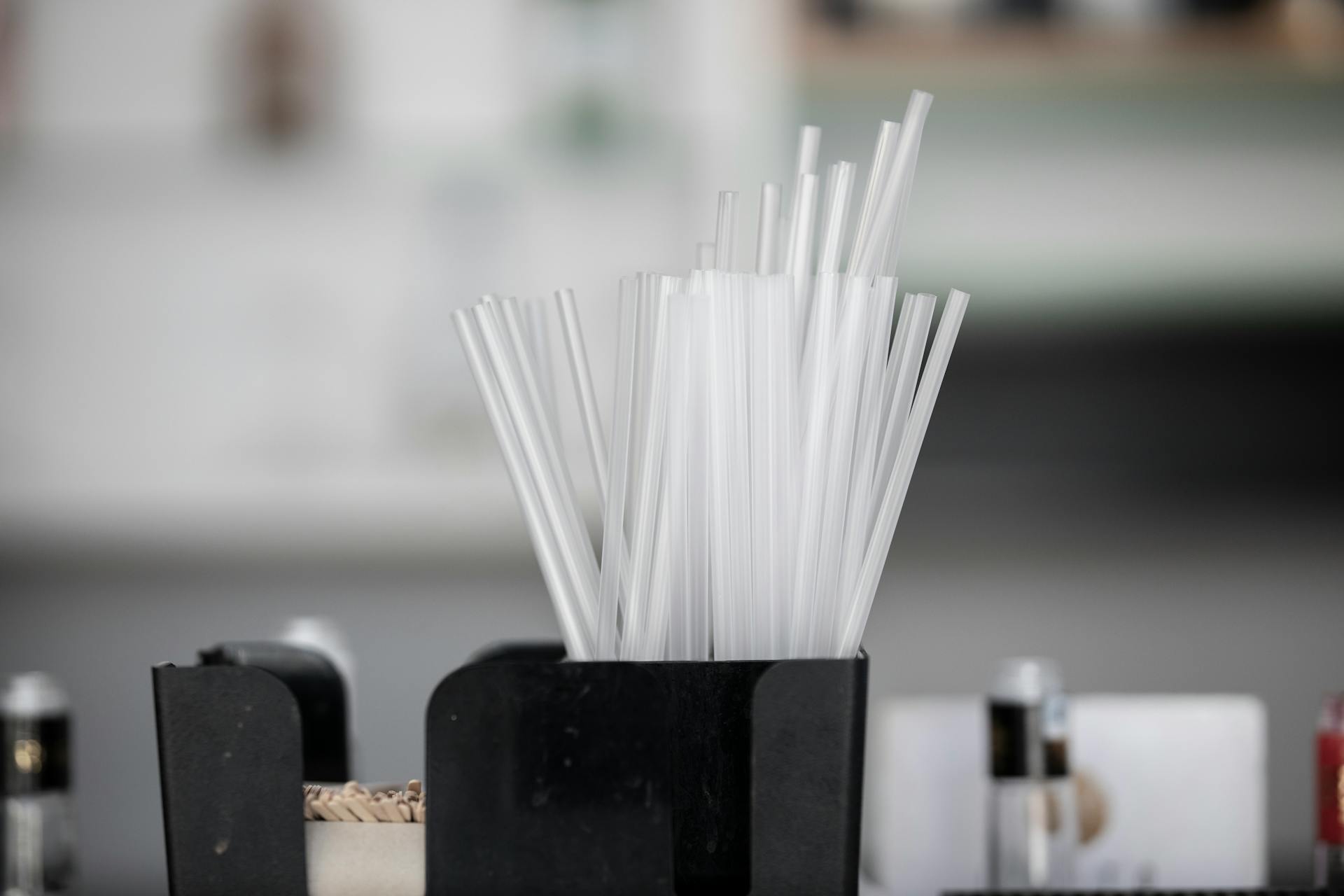 Drinking Straws on a Plastic Container