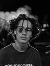 Black and White Portrait of a Young Man with Curly Hair