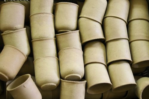 Free A collection of handmade clay pots stacked together, showcasing artisanal pottery. Stock Photo