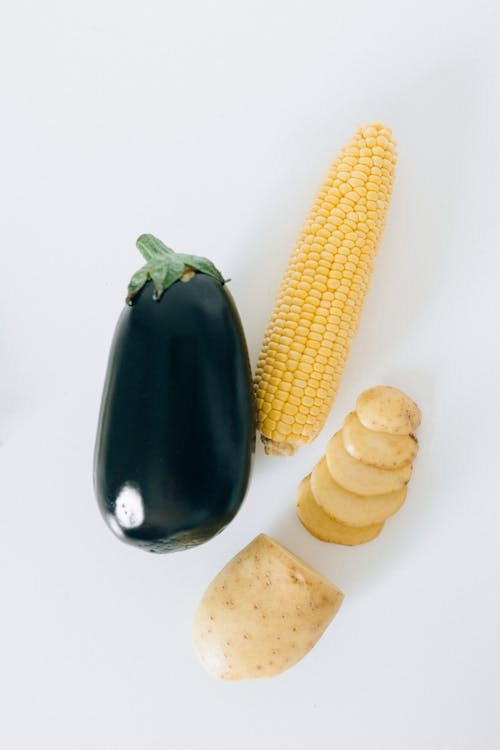 Corn and Corn on White Surface