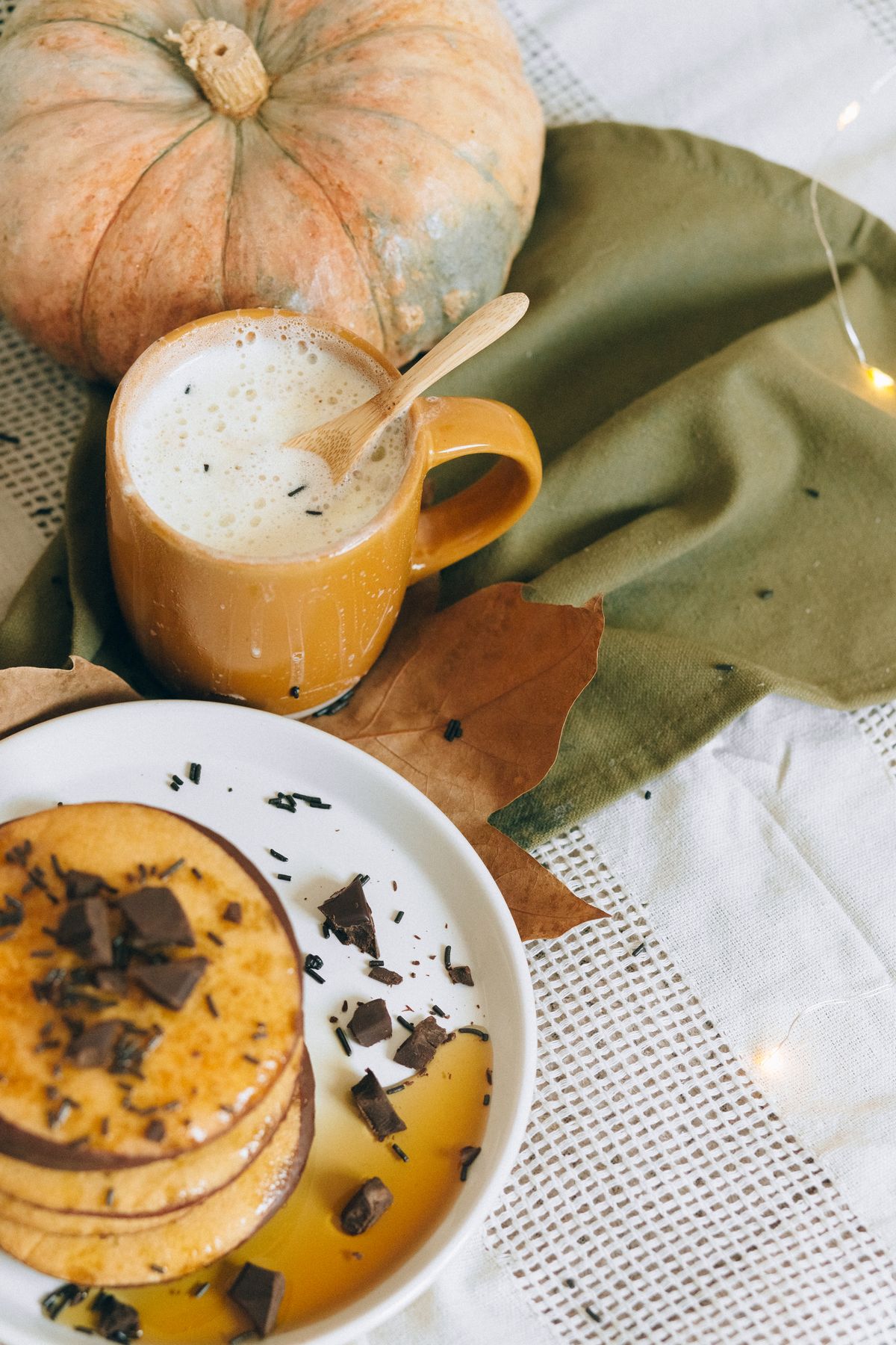Warm autumn breakfast with pancakes and a pumpkin spice latte