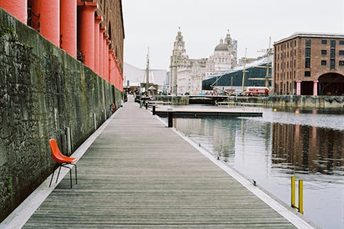 Red and Black Metal Chair on Dock