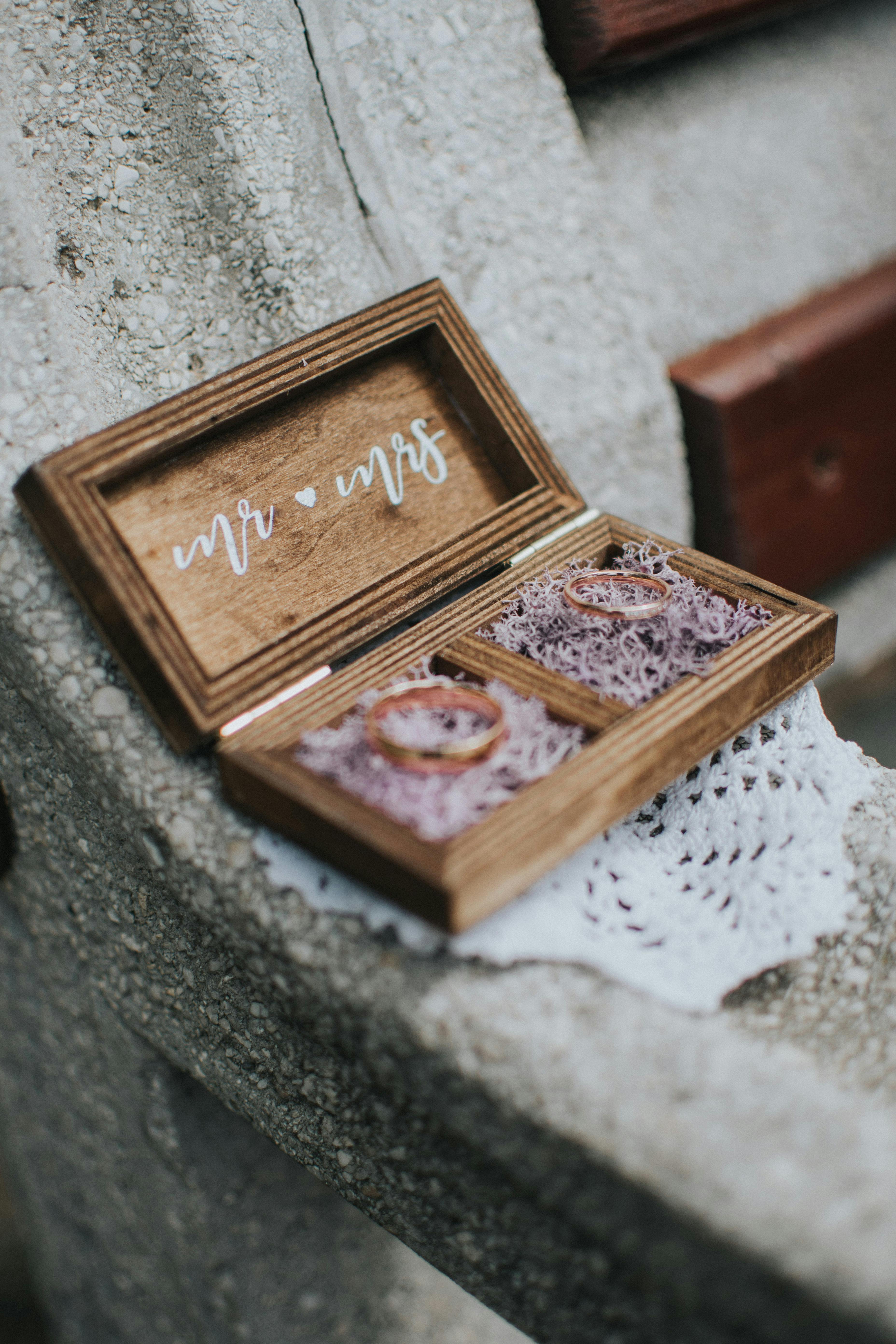 golden wedding rings in wooden box