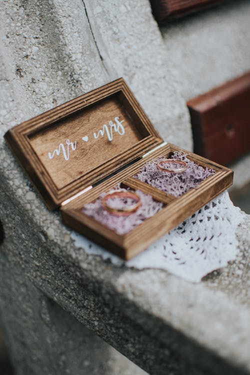 Golden wedding rings in wooden box