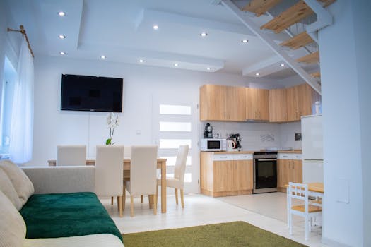 Spacious modern living and dining area with contemporary furniture and minimalist decor.