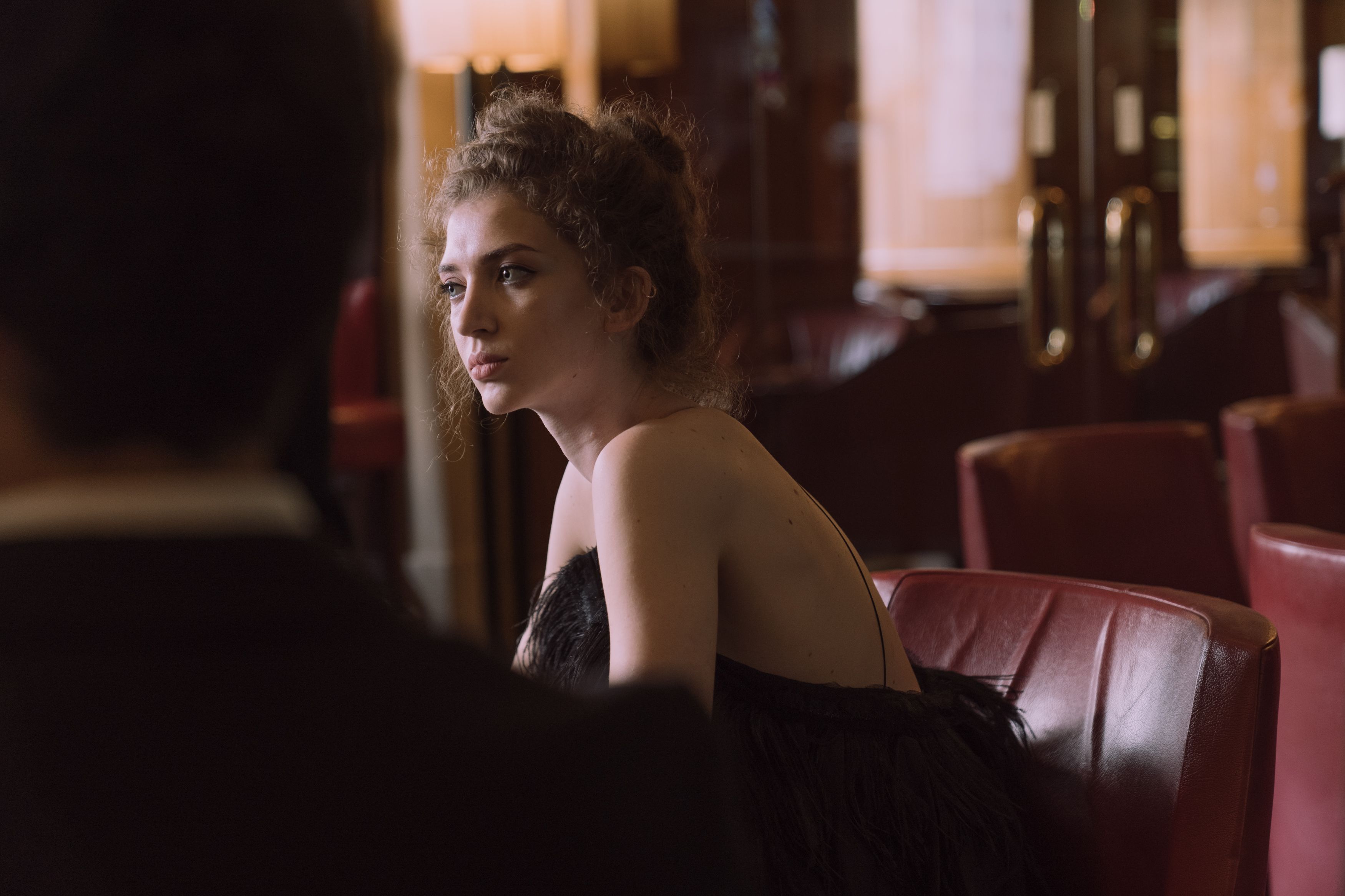 Woman in Black Dress Sitting on Chair · Free Stock Photo
