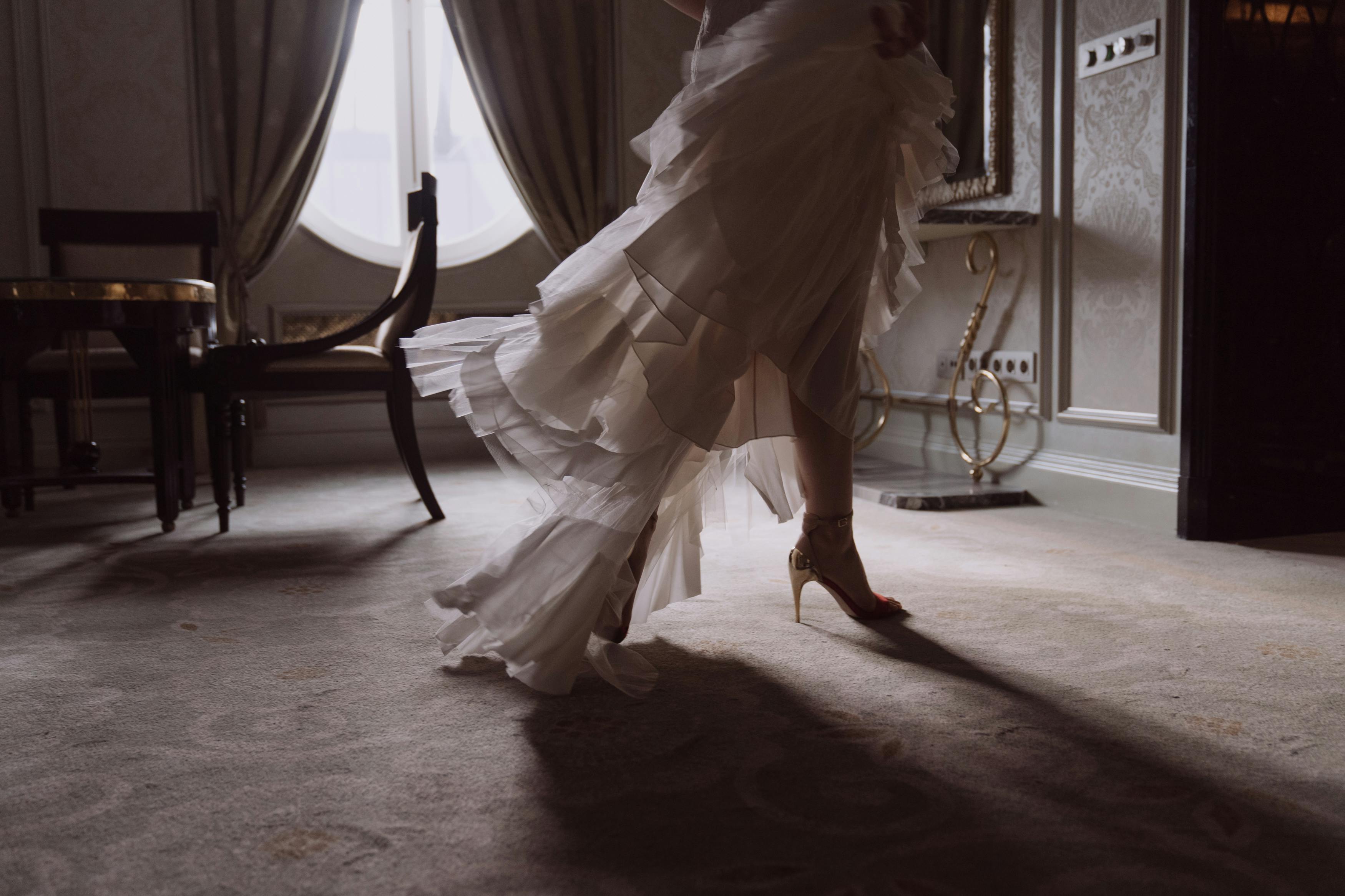 person in white dress running