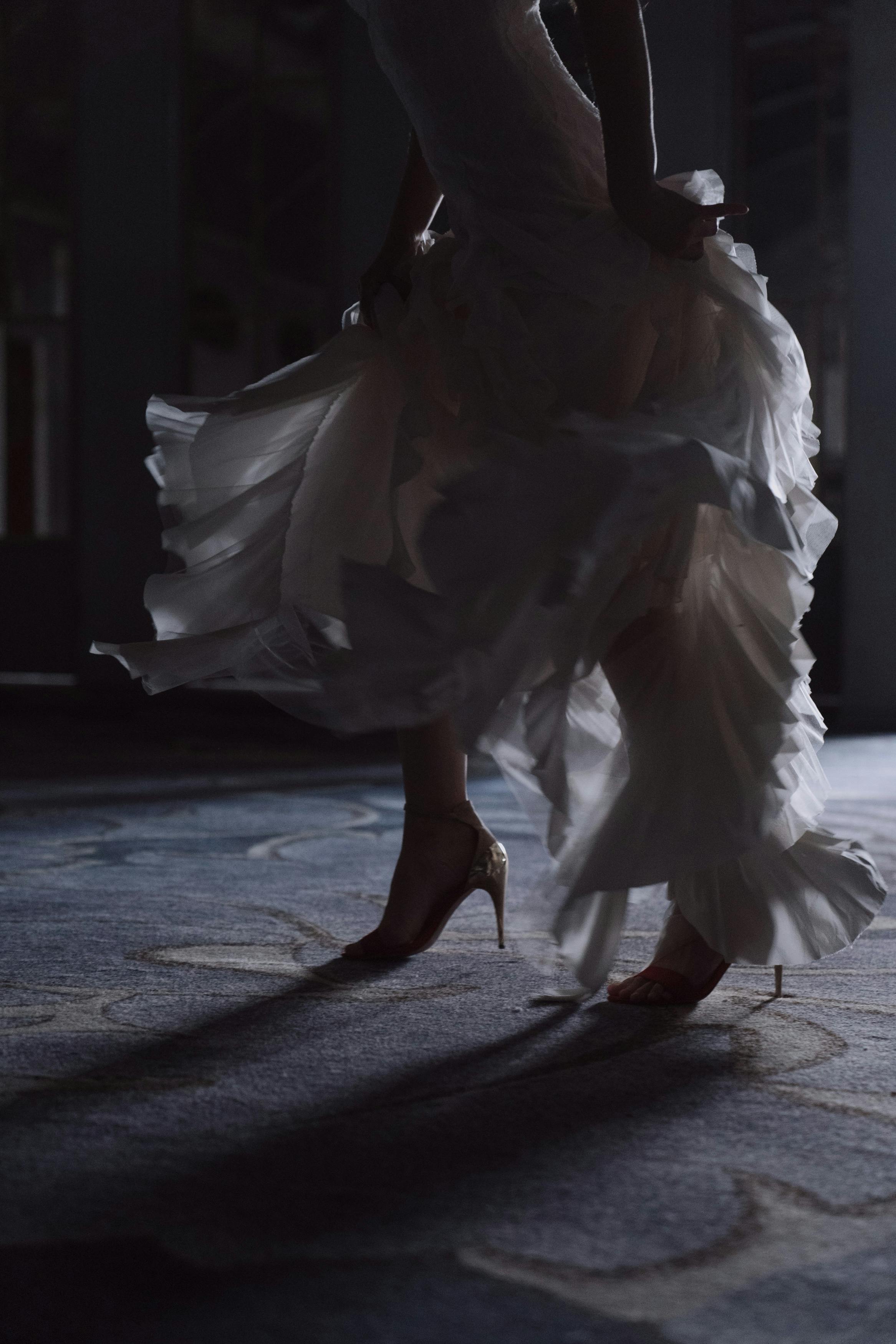 person in white dress dancing