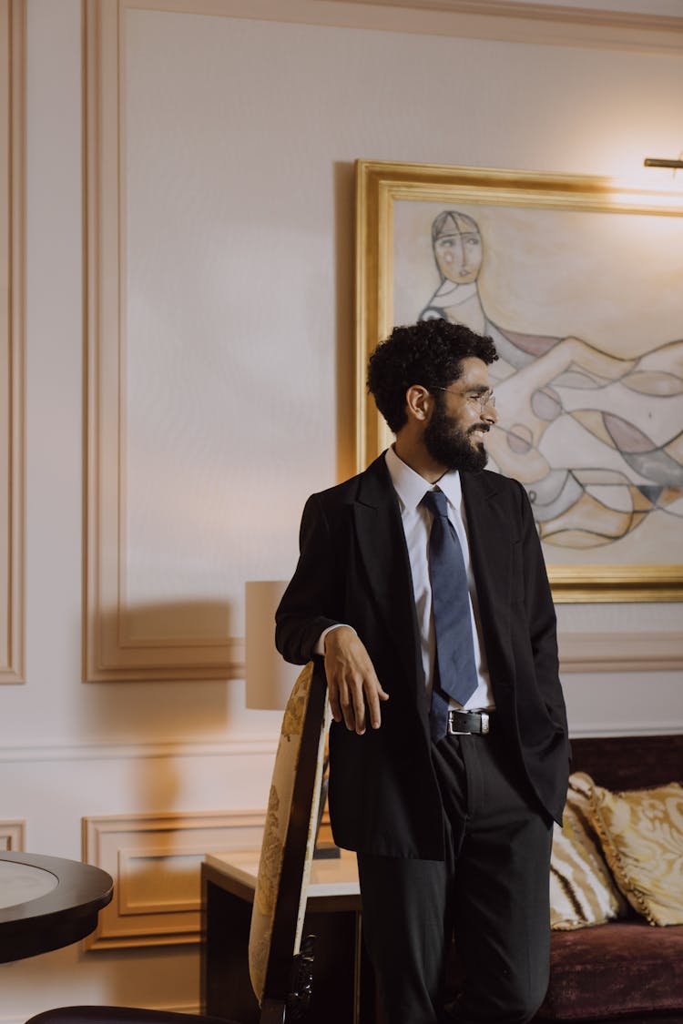 A Man In Black Suit Smiling