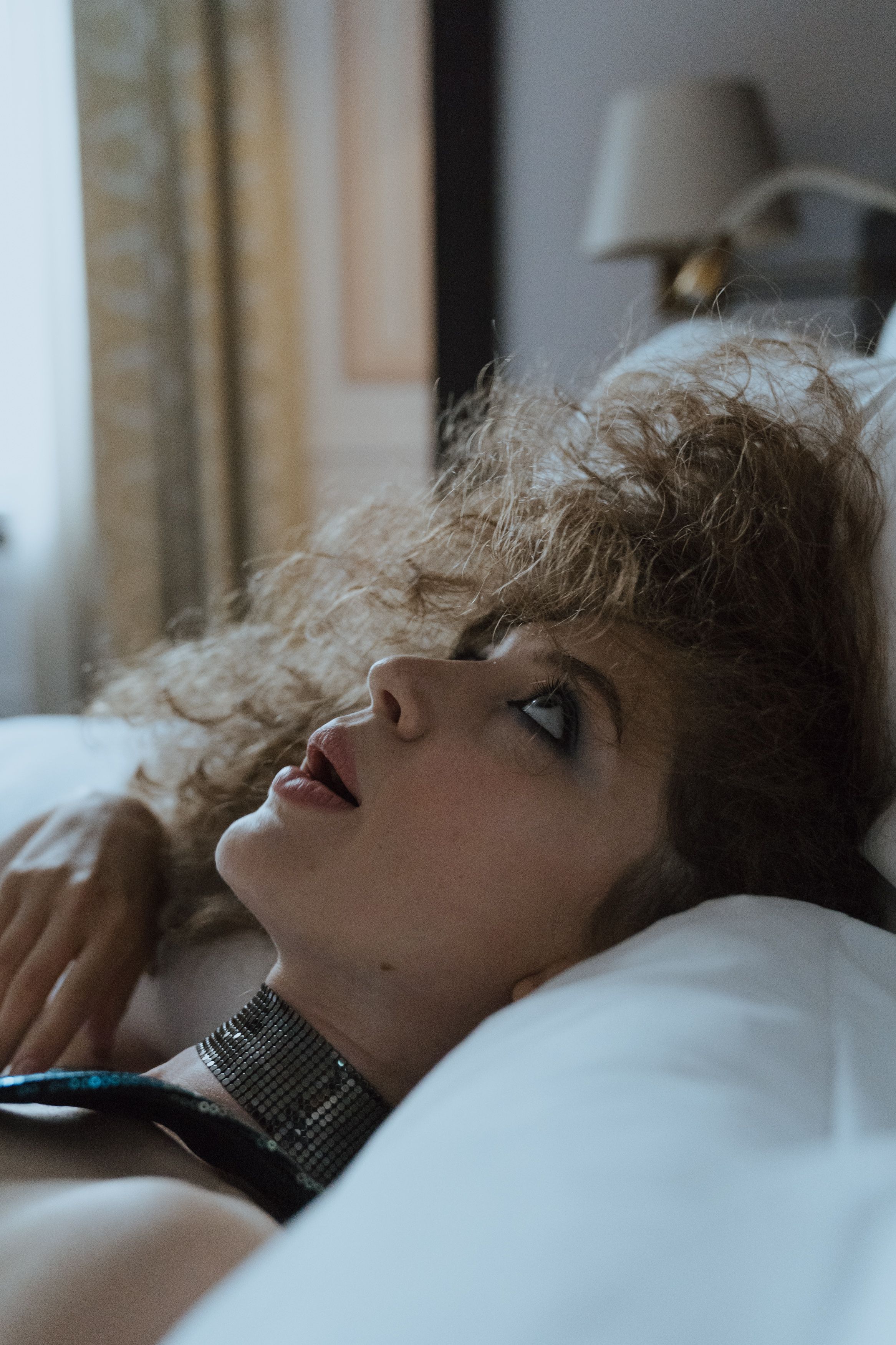 Woman in Black Dress Lying on Bed · Free Stock Photo