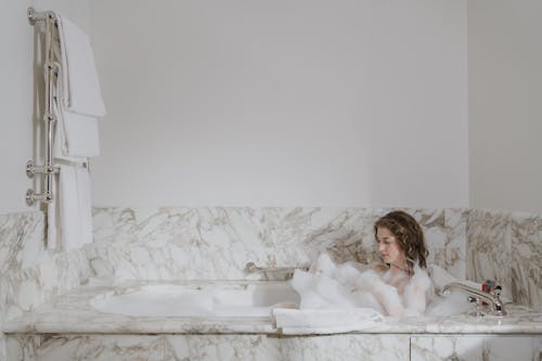 Free Woman Taking a Bubble Bath  Stock Photo
