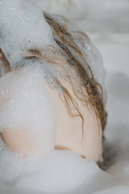 Close-Up View of a Person Taking a Bath
