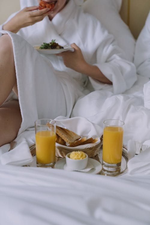 Free Person Having Breakfast in Bed  Stock Photo