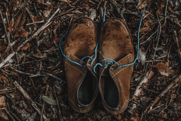 Old Worn Shoes On Ground