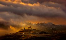 White and Brown Houses Under Cloudy Sky