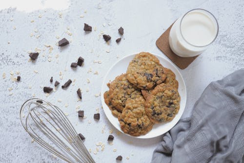 Free Cookies on Plate and a Glass of Milk Stock Photo