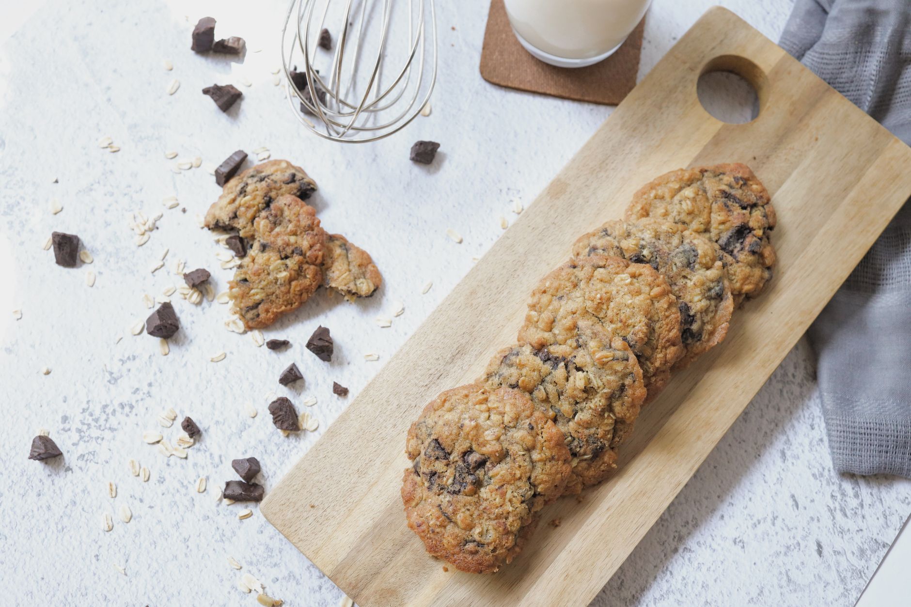 Freshly baked healthy chocolate chip cookies on parchment paper
