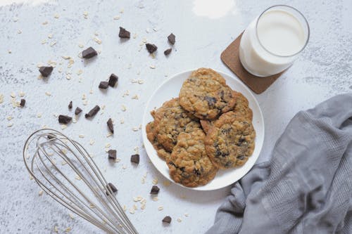 Free Cookies on Plate and a Glass of Milk Stock Photo