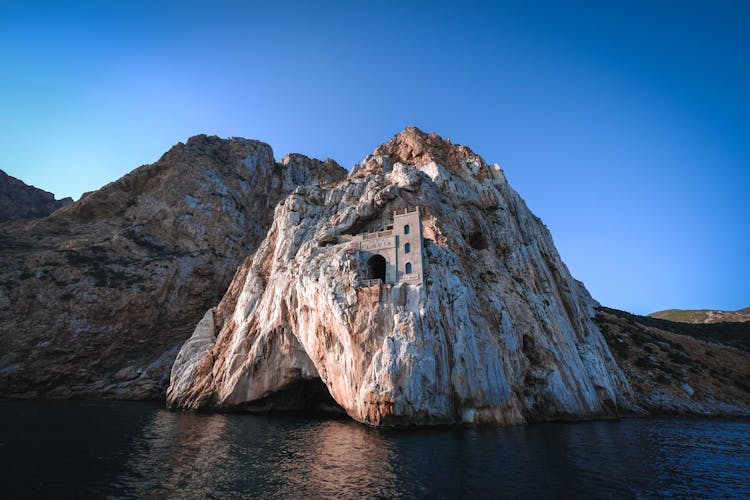 Historic Tower With Gate Placed On Cliff