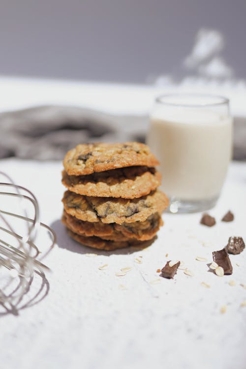 Cookies and a Glass of Milk on White Surface