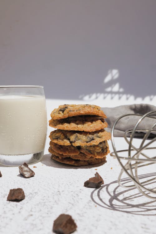 Free Stack of Cookies Beside a Glass of Milk Stock Photo
