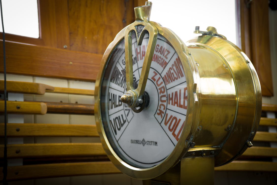 Free Close-up Photography of Round Brass-colored Ship Throttle Device Stock Photo