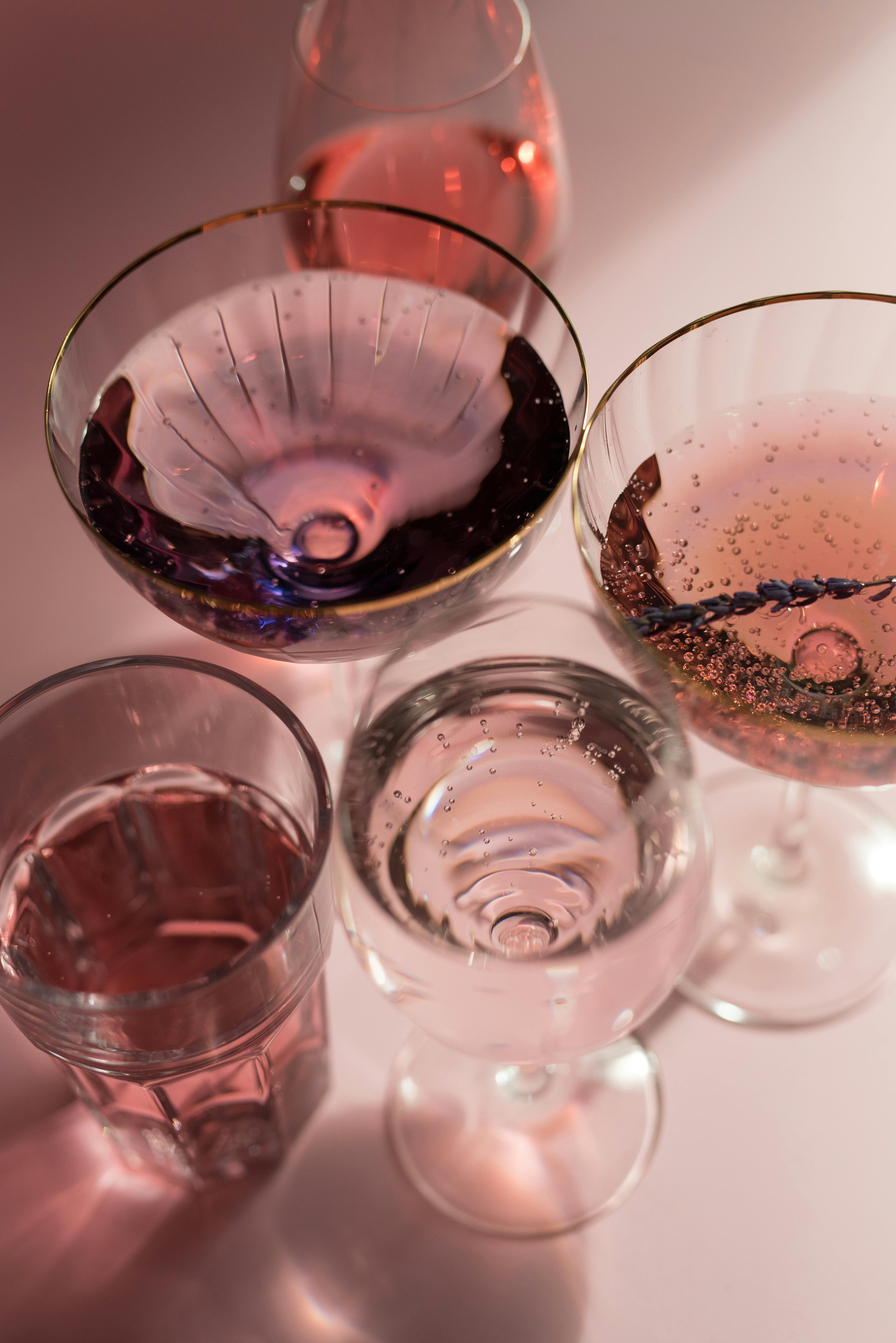 close up view of variety of alcoholic beverages on glasses