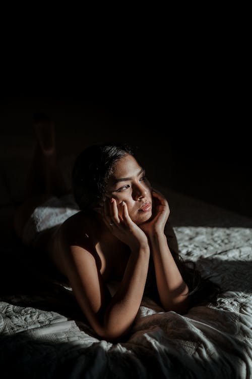 Woman Lying on Bed