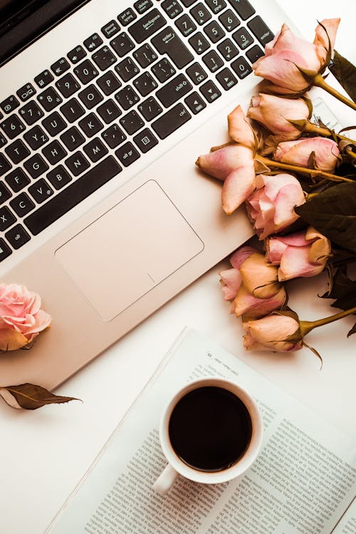 Free White Ceramic Mug on Macbook Pro Stock Photo