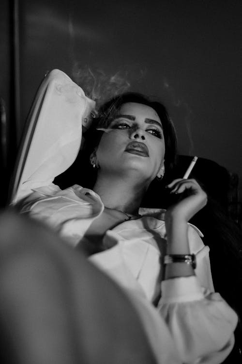 Free Grayscale Photo of a Woman Smoking Cigarette Stock Photo