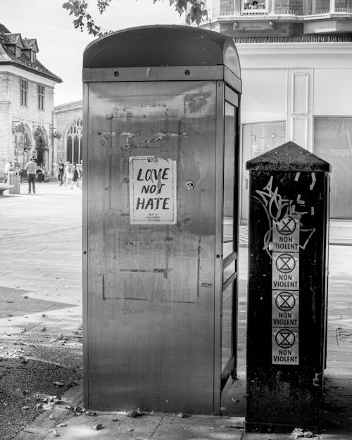 Monochrome Photo of a Telephone Booth and Post Box