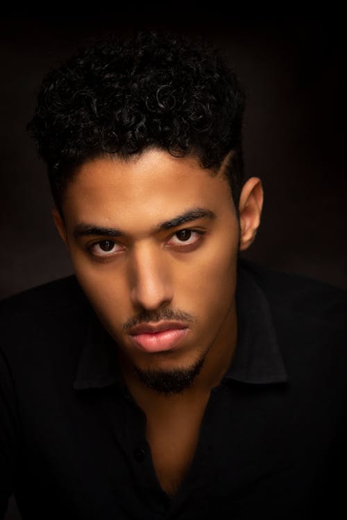 Man in Black Suit Shirt with Curly Hair