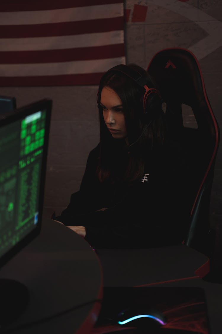 Woman In Sitting On Chair Using A Computer