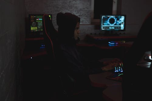 Free Man in Black Hoodie Using a Computer Stock Photo