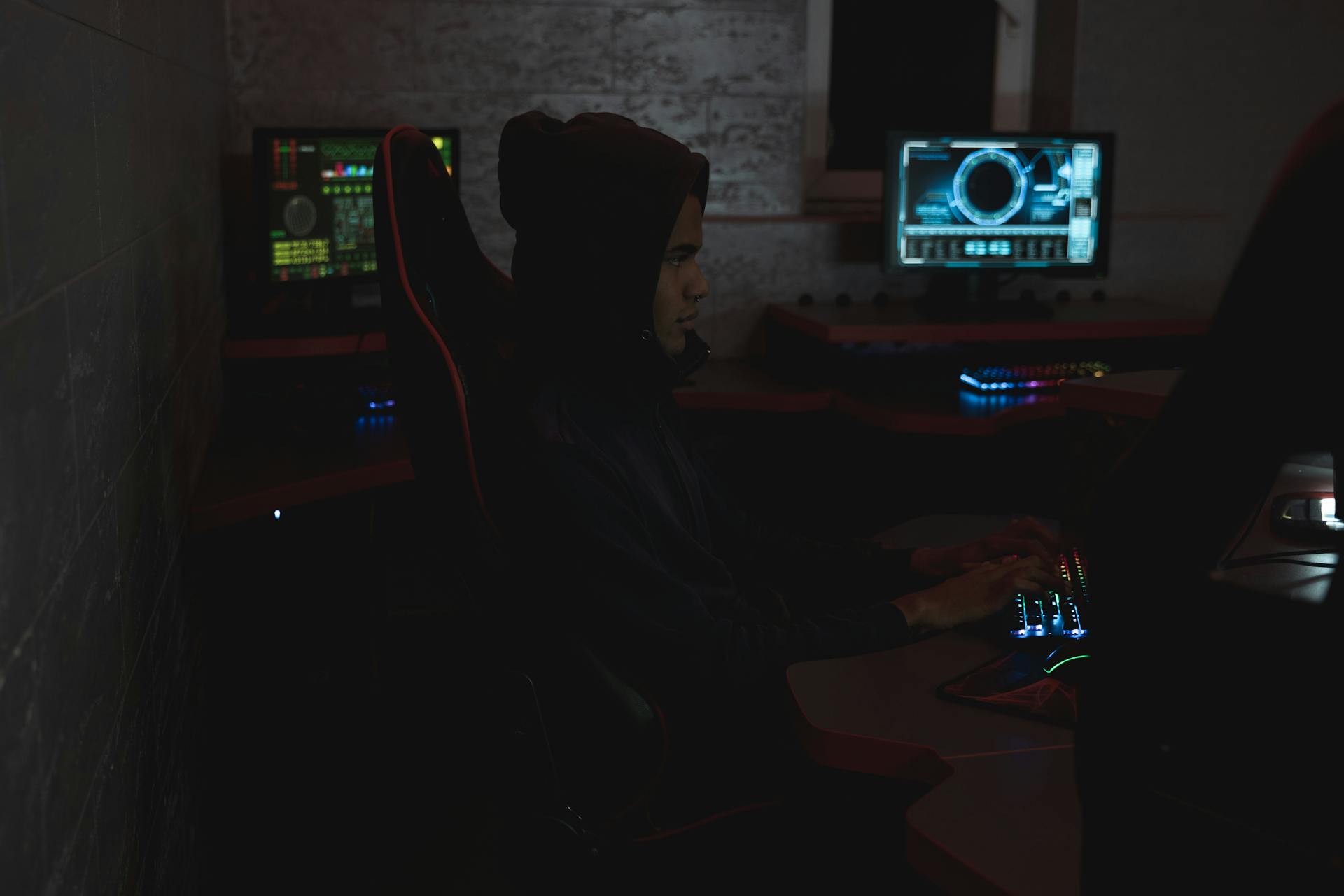 Man in Black Hoodie Using a Computer