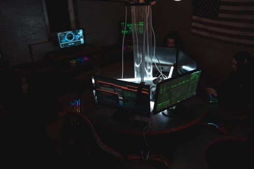 Cybersecurity analysts working collaboratively in a monitoring operations room