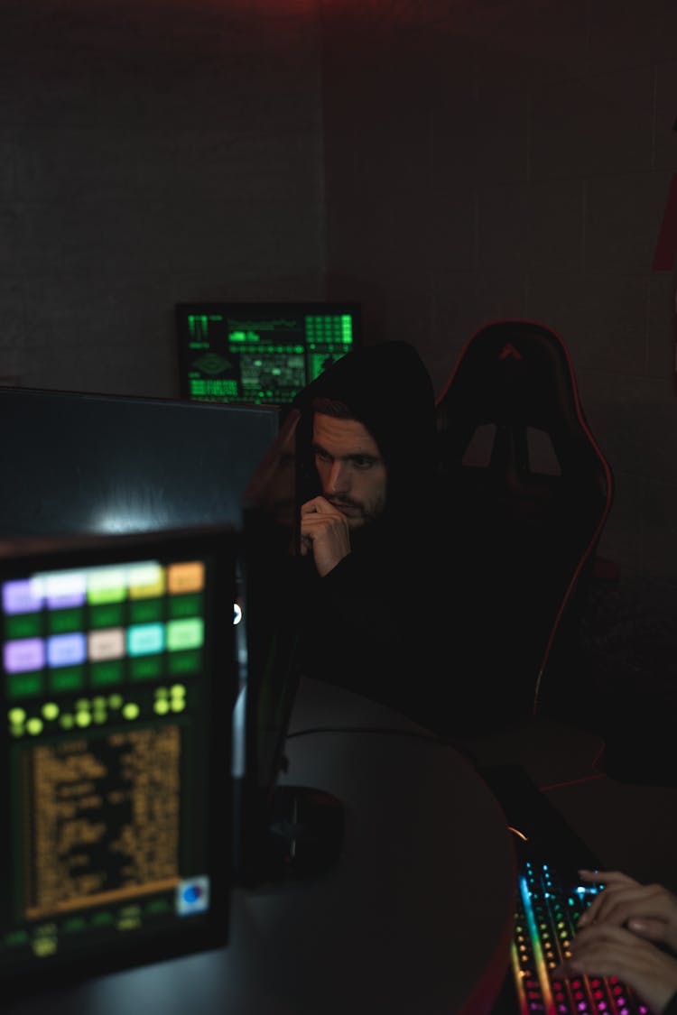 Man In Black Hoodie Sitting On Chair