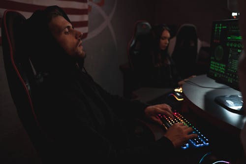 Man in Black Hoodie Using Computer