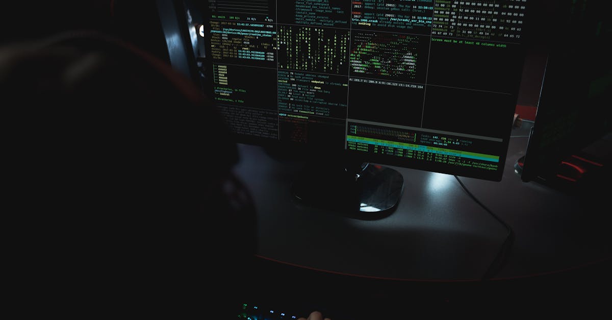 Dark room setup with code displayed on PC monitors highlighting cybersecurity themes.