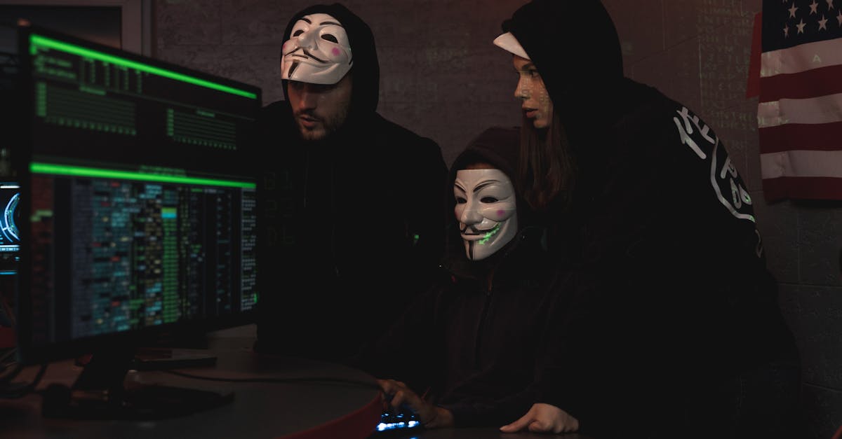 Three People Hacking a Computer System · Free Stock Photo