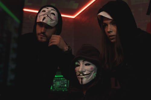 Free Three People Hacking a Computer System Stock Photo