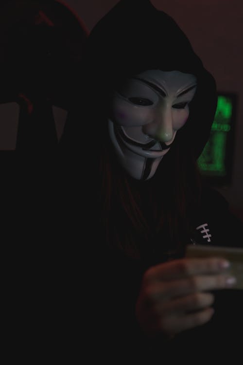 Close-up View of Person wearing Guy Fawkes Mask